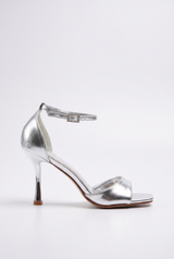 Silver sandals on a thin heel