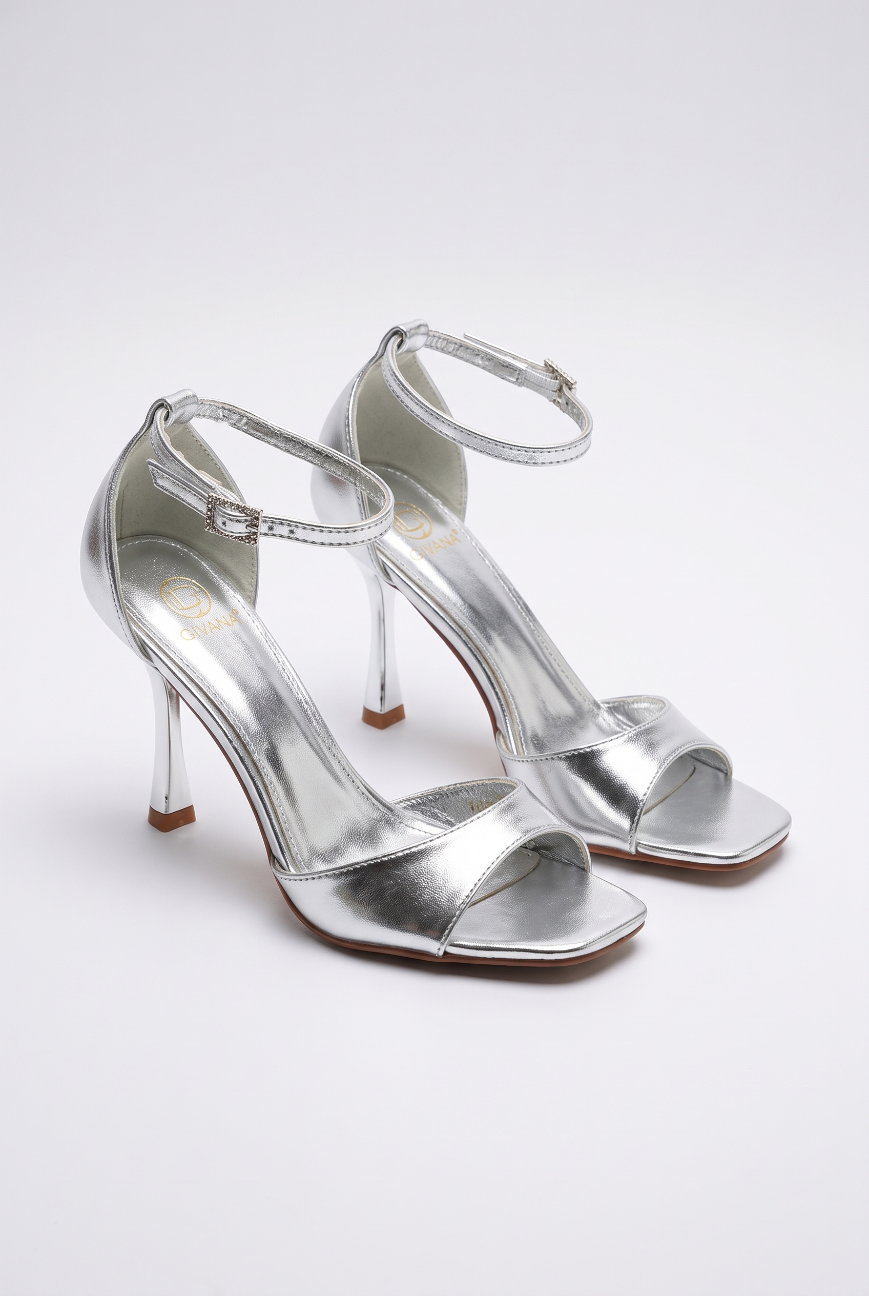 Silver sandals on a thin heel