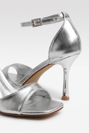 Silver sandals on a thin heel