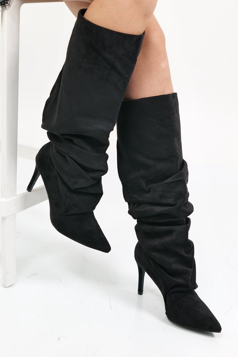 Black polished boots with a thin heel