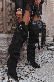 Black high-heeled boots with a decorative strap