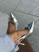 Silver heels on a thin heel