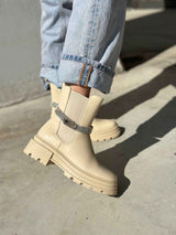 Beige flat ankle boots with strap